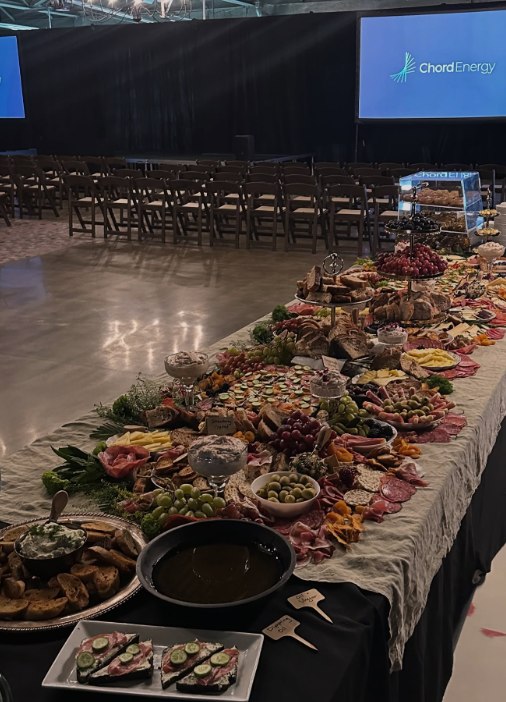 A long, abundant grazing table catered for a corporate event